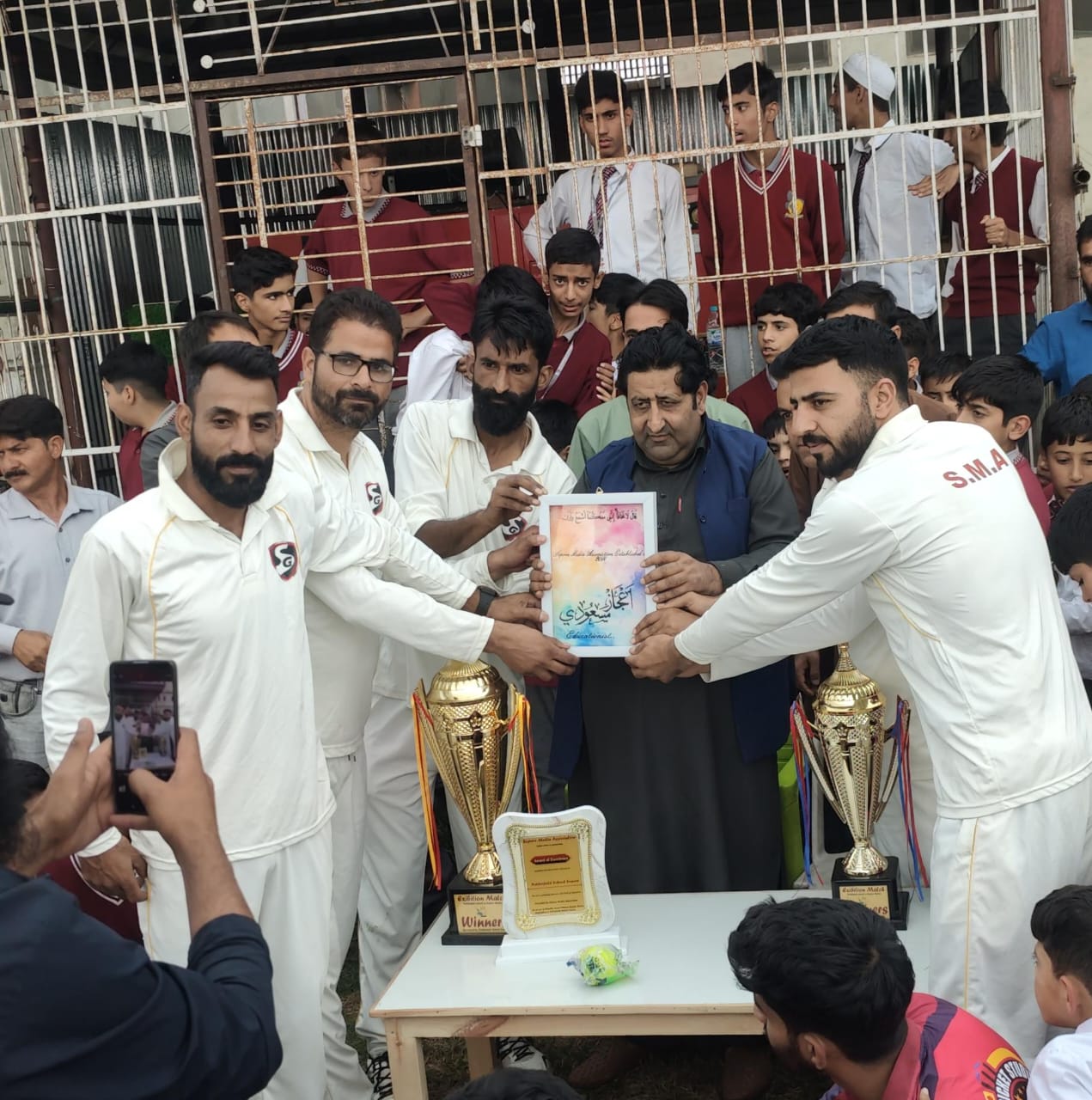 Neither field School and Sopore Media Association Host Cricket Match to Promote Sports and Drug Awareness
